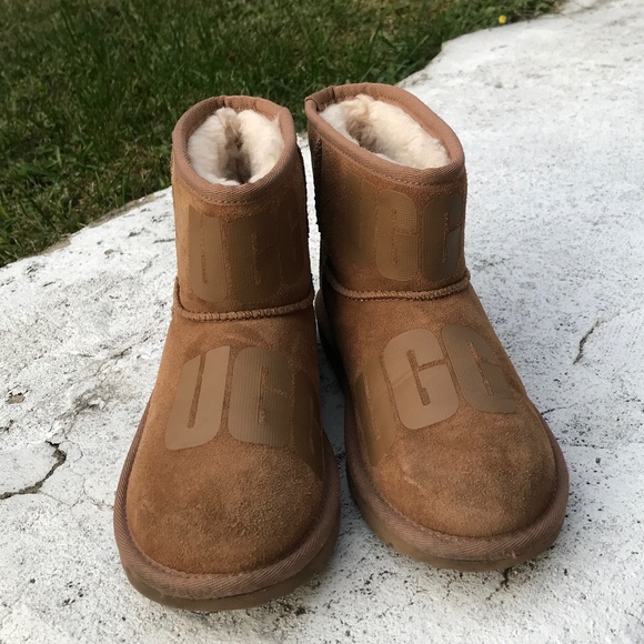 Tan Mini UGG With Logo on top and side of boots - Picture 1 of 5